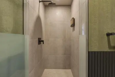 a bathroom with a shower with a glass door at New Luxury Studio Downtown Miami Prime Location in Miami