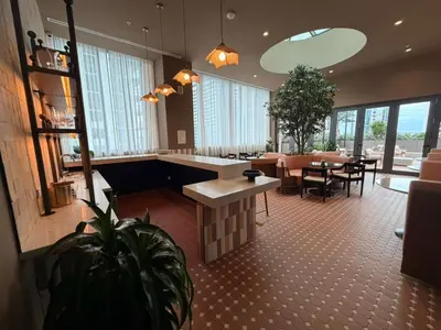 a lobby with a restaurant with tables and chairs at Lujoso apartamento ,The Crosby Miami World Center in Miami