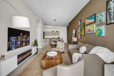a living room with a couch and a table at Lyfe Resort Ocean View Gym Direct Beach Access in Hollywood