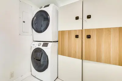 a washing machine and a dryer in a room at 3 Mi to Sea! Family Pool House in Fort Lauderdale in Fort Lauderdale