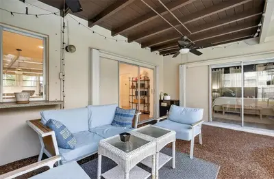 a living room with a couch and chairs and a bed at Spacious 3BR Home with Private Pool in Hollywood in Hollywood
