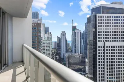 a balcony with a view of a city skyline at The Palazzo, Heart of Miami, Rooftop Pool, Lux Spa in Miami
