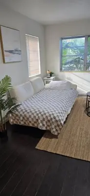 a bedroom with a large bed in a room at Cozy private 2BR Home with Outdoor space and BBQ grill in Hollywood