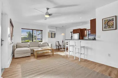 a living room with a couch and a table at Walnut Beach - By Atlantikos in Hollywood