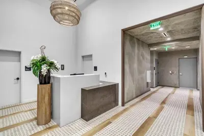 an office lobby with a reception desk and a potted plant at Free Parking Downtown Condo with Resort Amenities in Miami