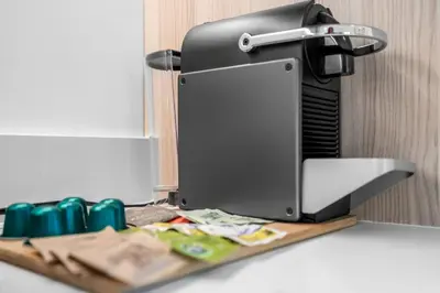 a printer sitting on top of a counter with money at Free Parking Downtown Condo with Resort Amenities in Miami