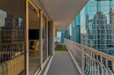 a balcony with a view of a city at Brickell Bayfront Oasis Stunning Views Pool Gym in Miami