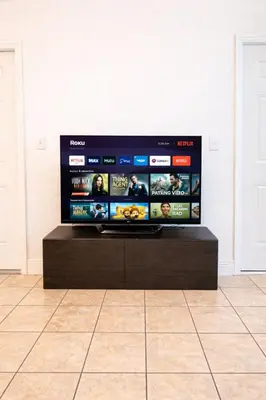 a flat screen tv sitting on top of a table at Best location in Coconut Grove in Miami