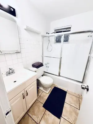 a bathroom with a shower and a toilet and a sink at Best location in Coconut Grove in Miami