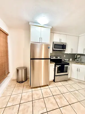 a kitchen with a stainless steel refrigerator at Best location in Coconut Grove in Miami