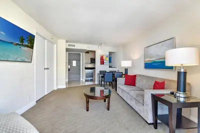 a living room with a couch and a table at Intracoastal Oasis in Fort Lauderdale