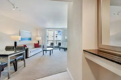 a living room with a couch and a table at Intracoastal Oasis in Fort Lauderdale