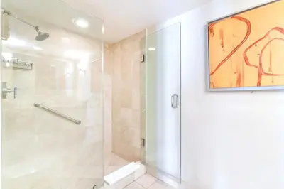 a bathroom with a shower with a glass door at Intracoastal Oasis in Fort Lauderdale