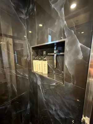 a bathroom with a black marble wall at 76 Tropical Retreat in Miami in Miami