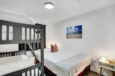 a bedroom with two bunk beds and a desk at 397 A - Beautiful Home in Miami in Miami