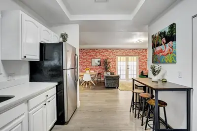 a kitchen with a black refrigerator and a table at 397 A - Beautiful Home in Miami in Miami