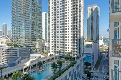 an aerial view of a city with tall buildings at Stylish Urban 1BR Downtown Rooftop Pool & Views in Miami