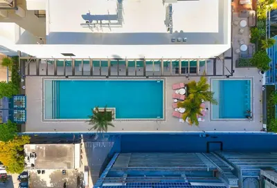 an overhead view of a building with two swimming pools at Modern MIA Worldcenter Studio with Balcony Pool & Gym in Miami