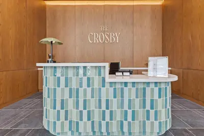 a lobby with a striped counter in a building at Modern MIA Worldcenter Studio with Balcony Pool & Gym in Miami