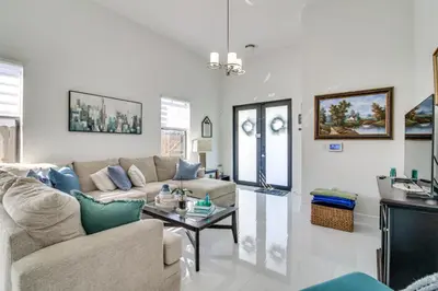 a living room with a couch and a table at Easy Park and University Access! Family Miami Escape in Miami