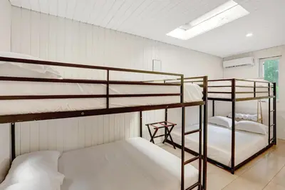 two bunk beds in a room with white walls at Casa in Tropic Paradise with Pool and BBQ in Biscayne Park