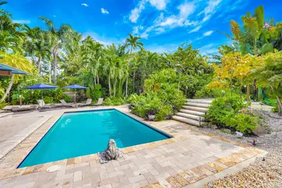 a swimming pool in the backyard of a villa at Casa in Tropic Paradise with Pool and BBQ in Biscayne Park