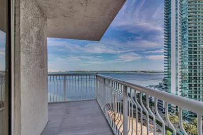 a balcony with a view of the ocean at Luxe Miami Vice Condo! Bay Views and Pool Access in Miami