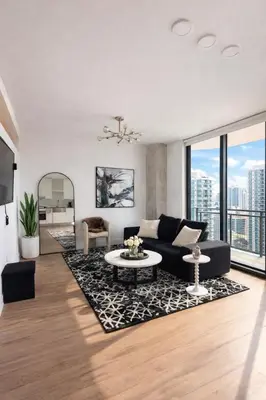 a living room with a couch and a table at Prime Miami location - Modern Skyline Stay in Miami