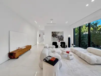 a living room with white furniture and large windows at Luxury Pool Home - Downtown Brickell in Miami