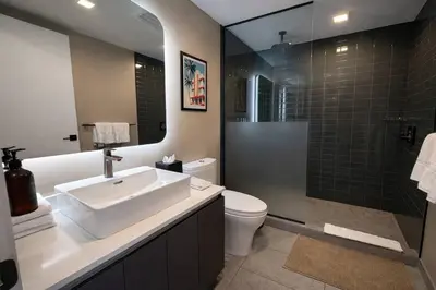 a bathroom with a sink and a toilet and a shower at Miami Bay Million-Dollar View | Private Condo in Miami