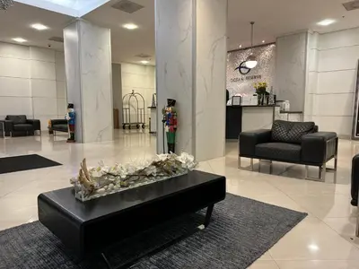 a lobby with a table with shells on it at Ocean Reserve Miami Luxury Rentals in Sunny Isles Beach