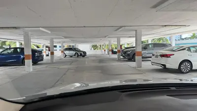 a parking lot with cars parked in it at Ocean Reserve Miami Luxury Rentals in Sunny Isles Beach