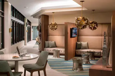 a lobby with couches and a table and chairs at Residence Inn by Marriott Miami Beach South Beach in Miami Beach