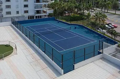 a tennis court on top of a building at Castle Beach Club Apartments in Miami Beach