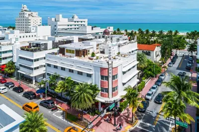 an aerial view of a city with palm trees and the ocean at Dream South Beach, by Hyatt in Miami Beach