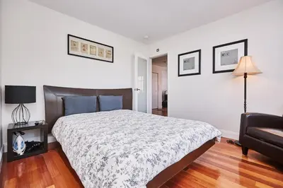 a bedroom with a bed and a couch at Hudson Apartments in Miami Beach