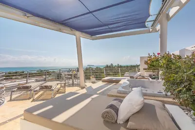 a patio with a view of the ocean at SBV Luxury Ocean Hotel Suites in Miami Beach