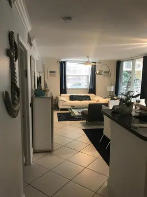 a room with a kitchen and a living room at The Nautical! Amazing 3Bed 2Bath Apartment at Aventura Yacht Club in Aventura