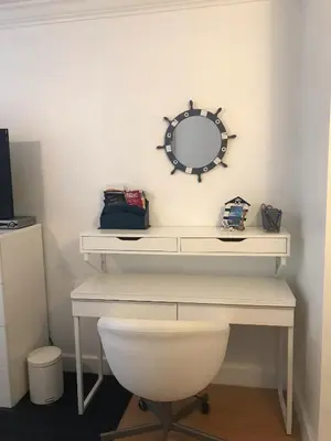 a white desk with a mirror on a wall at The Nautical! Amazing 3Bed 2Bath Apartment at Aventura Yacht Club in Aventura