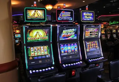 a bunch of slot machines in a casino at Miccosukee Casino & Resort in Miami