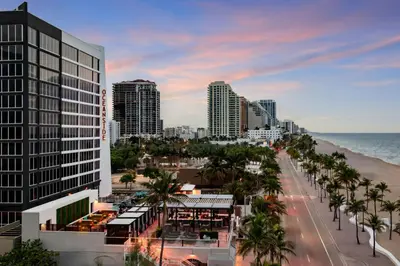 a view of a city with palm trees and the ocean at Courtyard by Marriott Oceanside Fort Lauderdale Beach in Fort Lauderdale