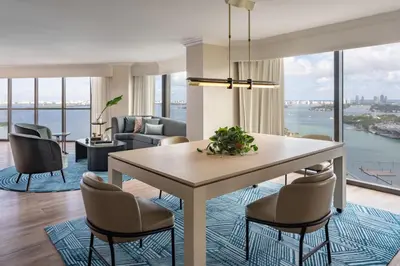 a dining room with a table and chairs with a view at Miami Marriott Biscayne Bay in Miami