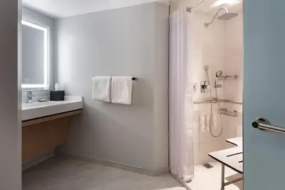 a bathroom with a shower and a sink at Miami Marriott Biscayne Bay in Miami