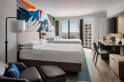 a hotel room with two beds and a desk at Miami Marriott Biscayne Bay in Miami