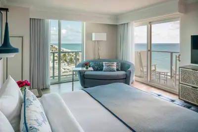 a bedroom with a bed and a view of the ocean at Hollywood Beach Marriott in Hollywood