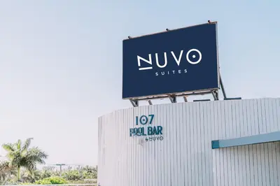 a sign for a nvyo suites on top of a building at Nuvo Suites Hotel - Miami Doral in Miami