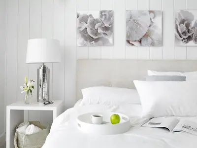a white bed with a bowl of fruit on it at Grand Beach Hotel in Miami Beach