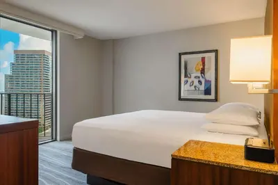 a bedroom with a large bed and a large window at Hyatt Regency Miami in Miami