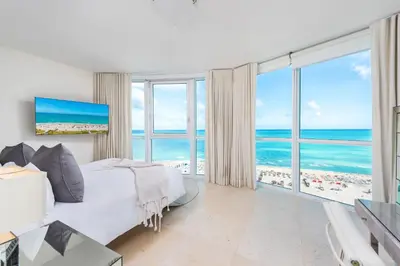 a bedroom with a bed and a view of the ocean at Oceanfront Private Condo at The Setai -2208 in Miami Beach