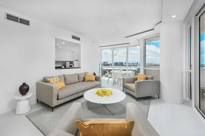 a living room with a couch and a table at 4B Super Premium Private Condo at the Setai in Miami Beach